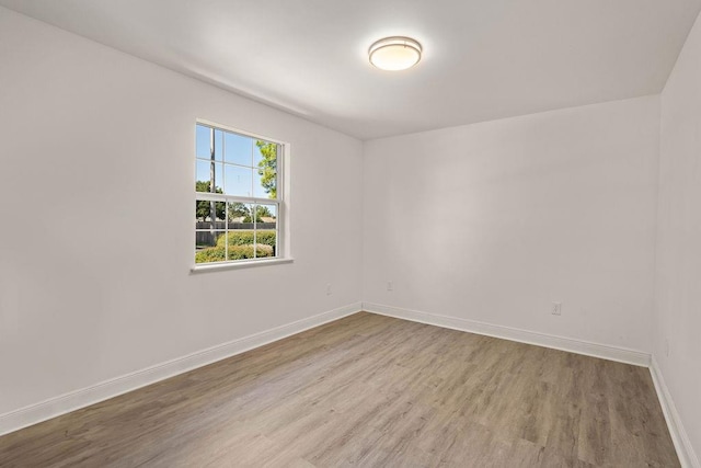 unfurnished room featuring light hardwood / wood-style flooring