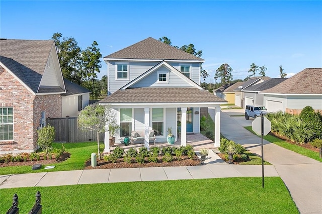 view of front of house featuring a front yard and a porch