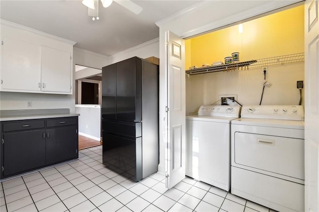 washroom with ornamental molding, separate washer and dryer, ceiling fan, and light tile patterned floors