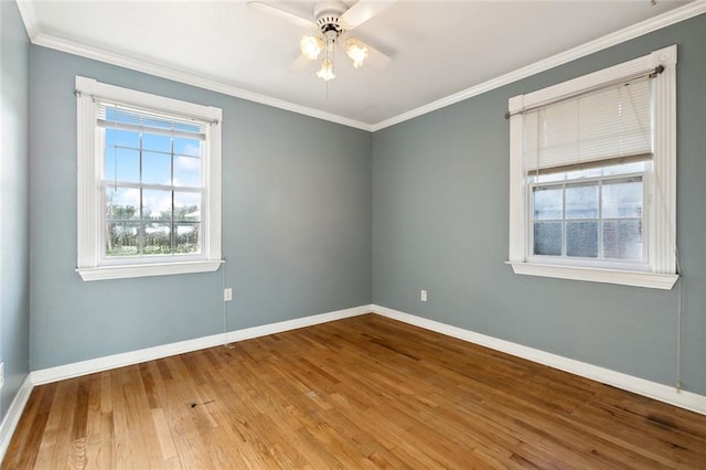 unfurnished room featuring hardwood / wood-style flooring, crown molding, and ceiling fan