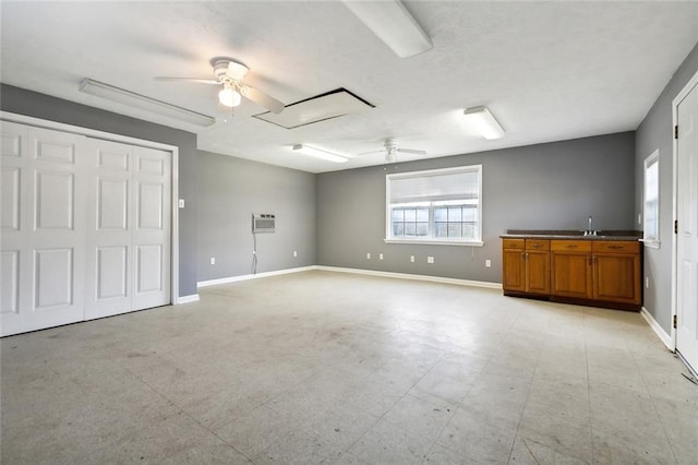 interior space with sink and an AC wall unit