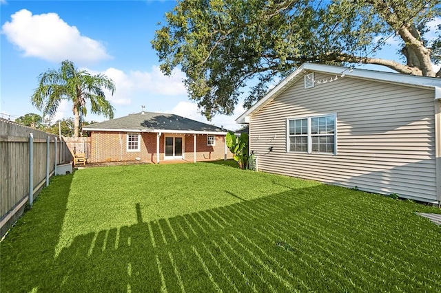 rear view of house with a lawn