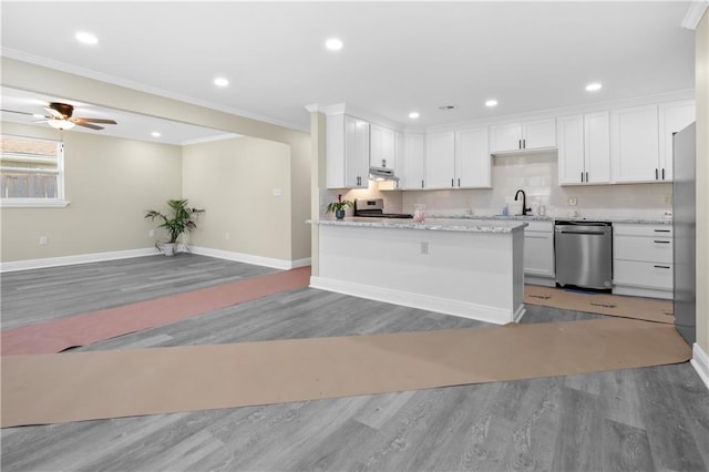 kitchen featuring white cabinets, light hardwood / wood-style floors, crown molding, and appliances with stainless steel finishes