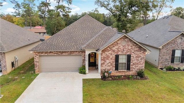 view of front of house with a front yard and a garage