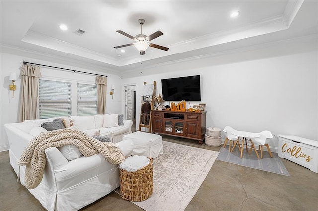 living room featuring crown molding, ceiling fan, and a raised ceiling