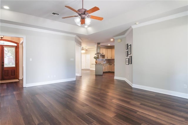 unfurnished living room with dark hardwood / wood-style flooring, ceiling fan, and crown molding