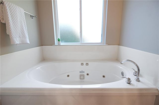 bathroom with a washtub