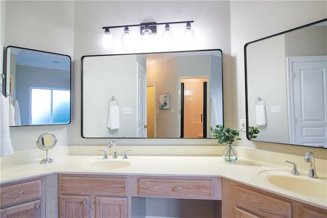 bathroom featuring ornamental molding and vanity