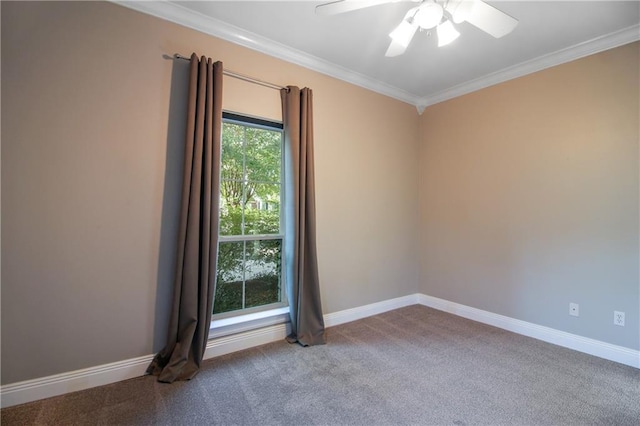 carpeted spare room with ornamental molding, a healthy amount of sunlight, and ceiling fan