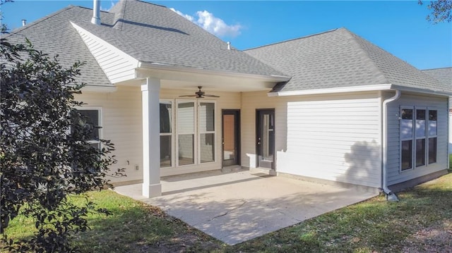 back of property featuring ceiling fan and a patio