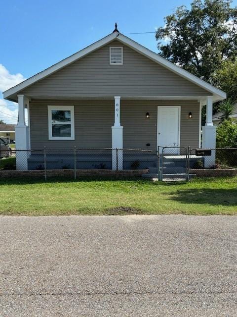 bungalow-style home with a front lawn