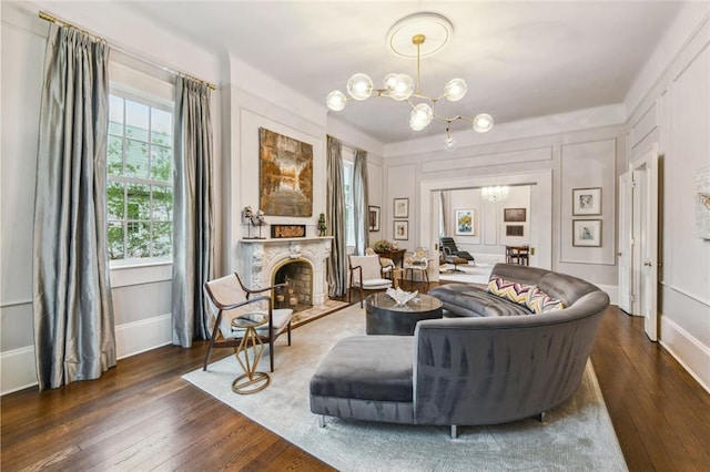 living room featuring a chandelier and dark hardwood / wood-style floors