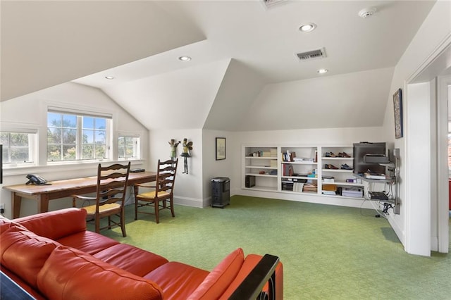 carpeted living room with vaulted ceiling