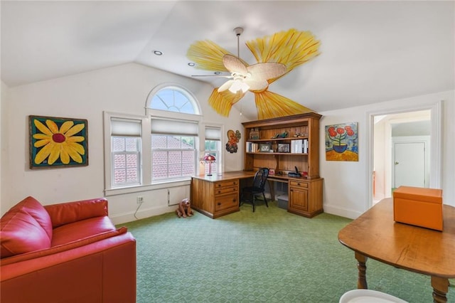 office space featuring carpet, ceiling fan, and vaulted ceiling