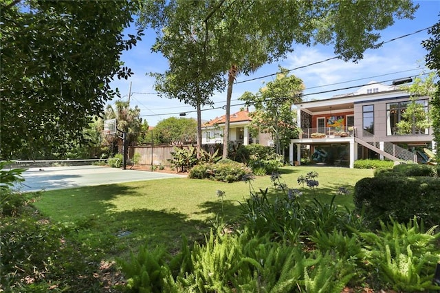 view of yard featuring basketball court