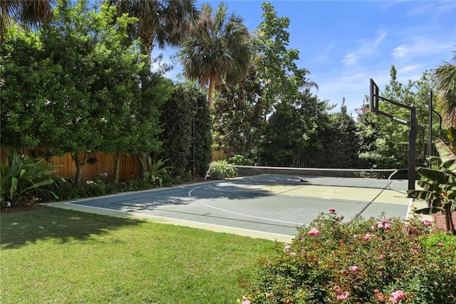 view of basketball court with a yard and tennis court