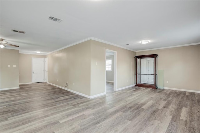 unfurnished room with ornamental molding, ceiling fan, and light hardwood / wood-style floors