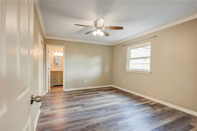 empty room with ceiling fan, wood-type flooring, and ornamental molding