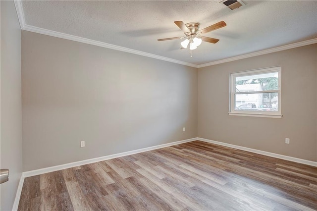 unfurnished room featuring ornamental molding, light hardwood / wood-style flooring, a textured ceiling, and ceiling fan