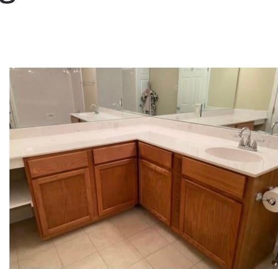 bathroom featuring tile patterned flooring and vanity