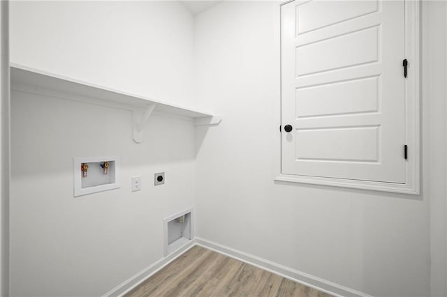 washroom featuring wood finished floors, laundry area, electric dryer hookup, washer hookup, and baseboards