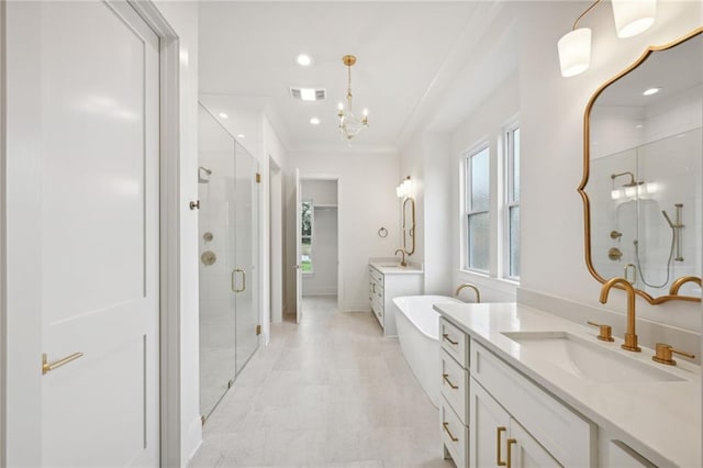 bathroom featuring walk in shower, vanity, and an inviting chandelier