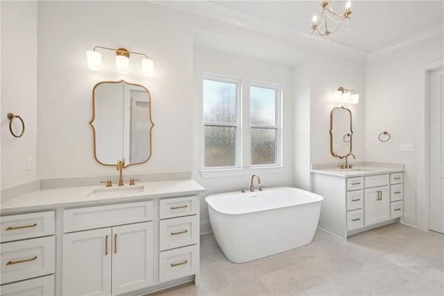 bathroom featuring vanity, a bath, and a notable chandelier