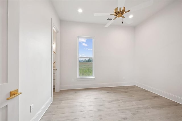 empty room featuring light hardwood / wood-style floors and ceiling fan