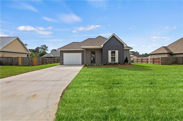 view of front of house featuring a garage and a front yard