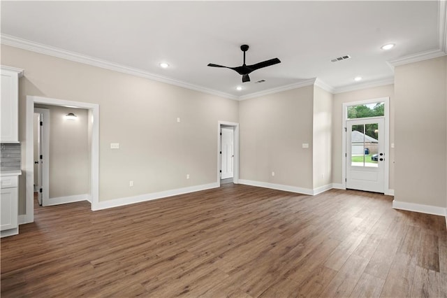 unfurnished living room featuring ceiling fan, crown molding, and dark hardwood / wood-style flooring