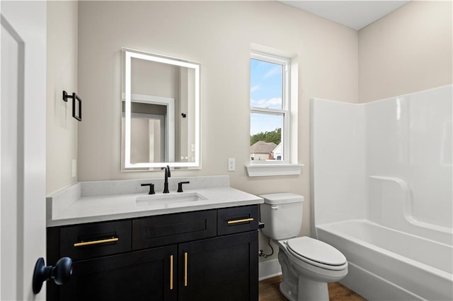 full bathroom featuring toilet, bathtub / shower combination, and vanity