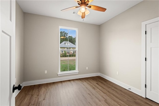 empty room featuring light hardwood / wood-style floors and ceiling fan