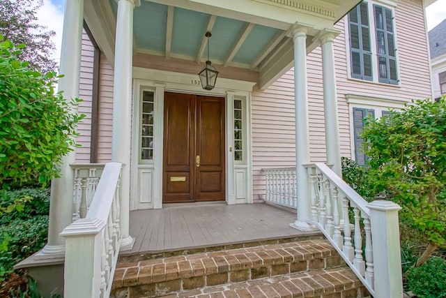 entrance to property featuring covered porch