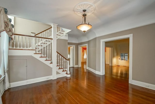 foyer entrance featuring dark wood-type flooring