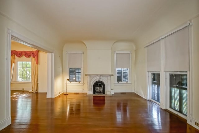 1521 Dufossat St, New Orleans, LA 70115 - unfurnished living room with a glass covered fireplace, wood finished floors, and baseboards