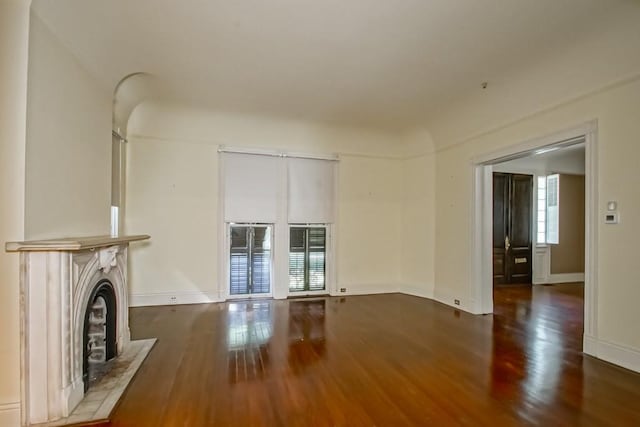 unfurnished living room featuring dark hardwood / wood-style floors