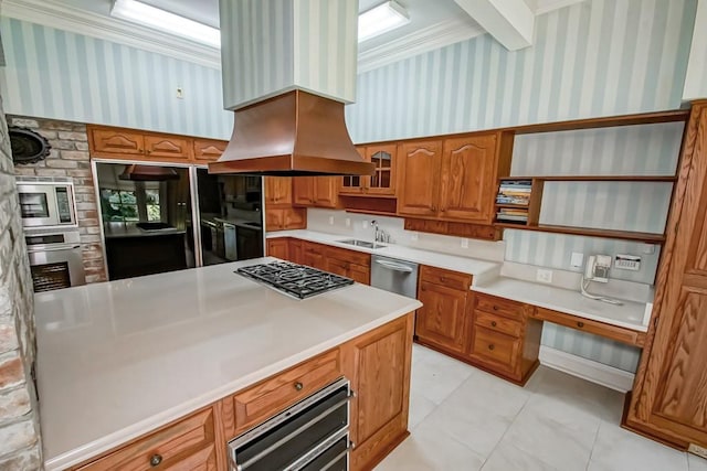 kitchen featuring crown molding, stainless steel appliances, sink, custom exhaust hood, and washer and dryer