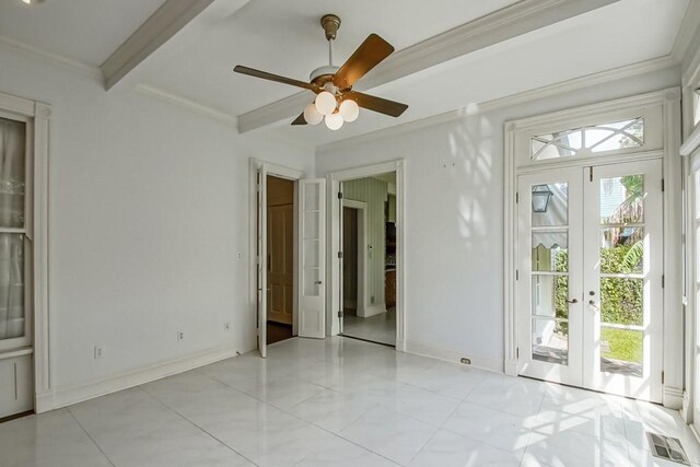 spare room featuring beamed ceiling, ceiling fan, french doors, and ornamental molding