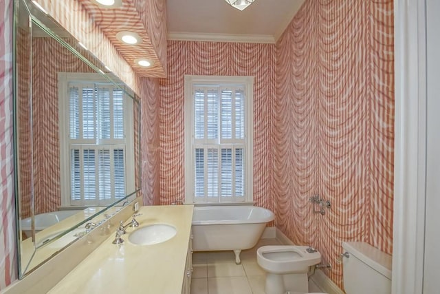 bathroom featuring a bidet, tile patterned flooring, ornamental molding, plenty of natural light, and a bathtub