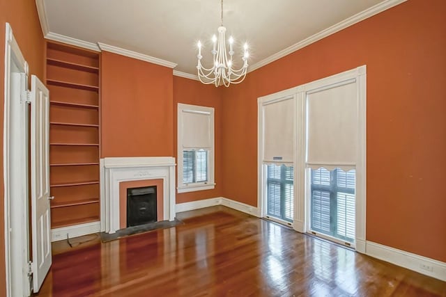 1521 Dufossat St, New Orleans, LA 70115 - unfurnished living room featuring a chandelier, wood finished floors, a fireplace with flush hearth, crown molding, and baseboards