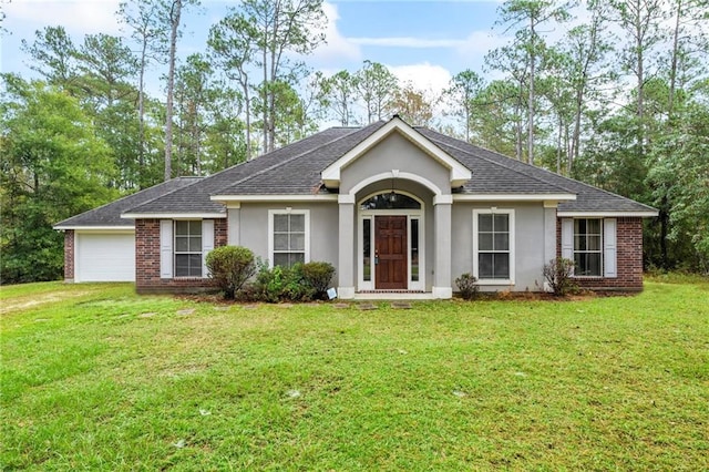 ranch-style home featuring a front lawn and a garage