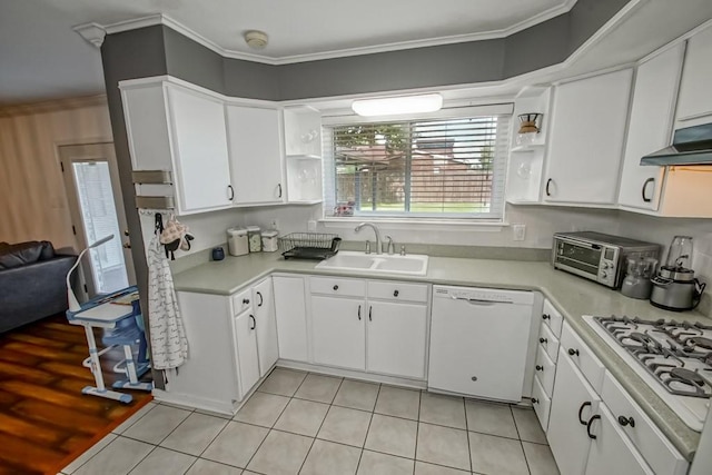 kitchen with white appliances, ornamental molding, sink, and white cabinets