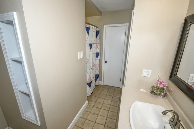 bathroom featuring tile patterned flooring and sink