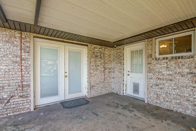 property entrance with french doors and a patio