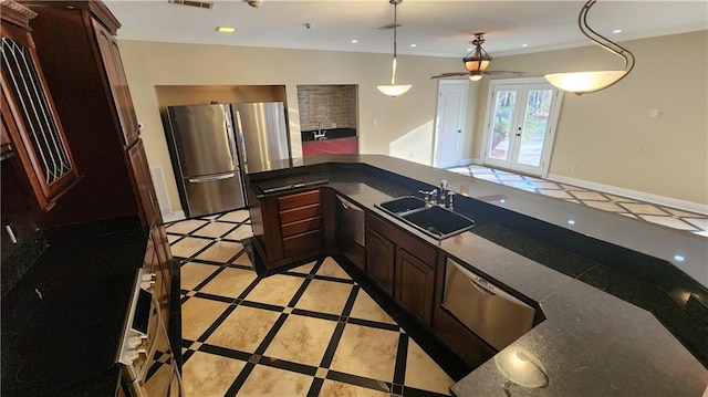 kitchen featuring stainless steel appliances, sink, ornamental molding, pendant lighting, and french doors