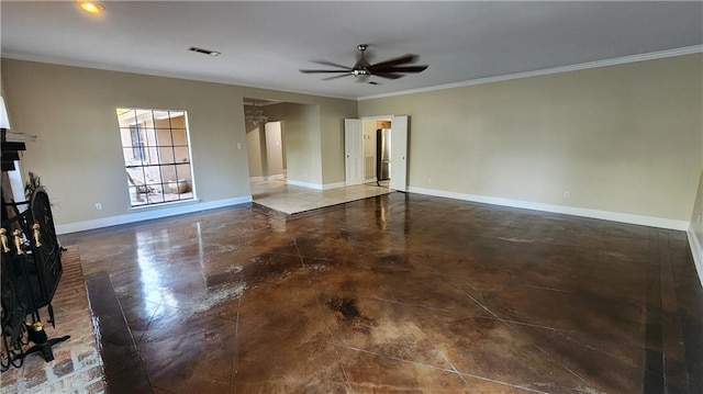 spare room with ceiling fan, ornamental molding, and a brick fireplace