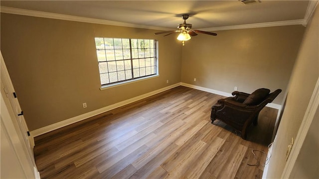 unfurnished room with ornamental molding, hardwood / wood-style floors, and ceiling fan