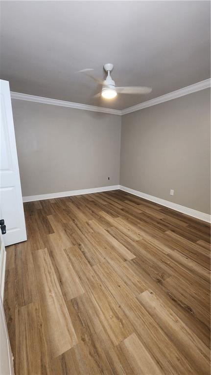 unfurnished room with hardwood / wood-style flooring, ceiling fan, and ornamental molding