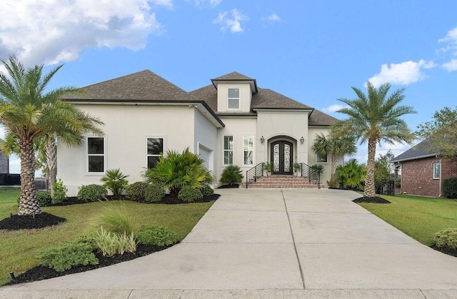 view of front of home featuring french doors and a front lawn