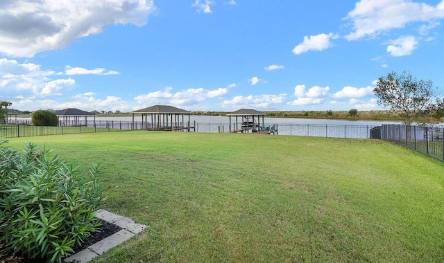 view of yard featuring a water view and a gazebo